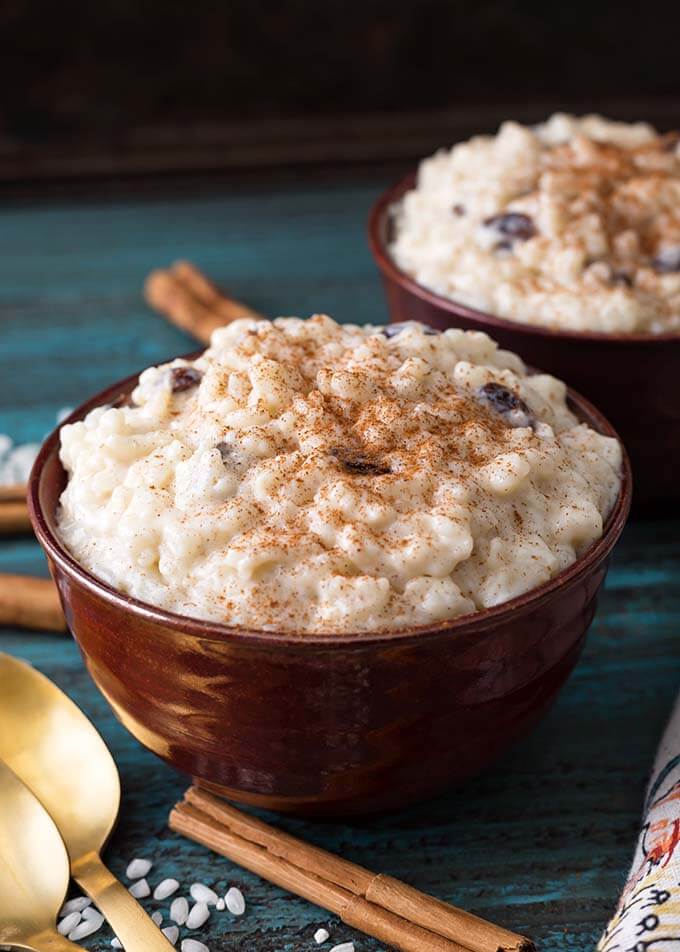 Closeup of two brown bowls of Rice Pudding