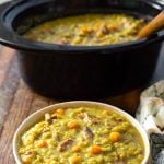 Slow Cooker Split Pea Soup in a bowl in front of crock