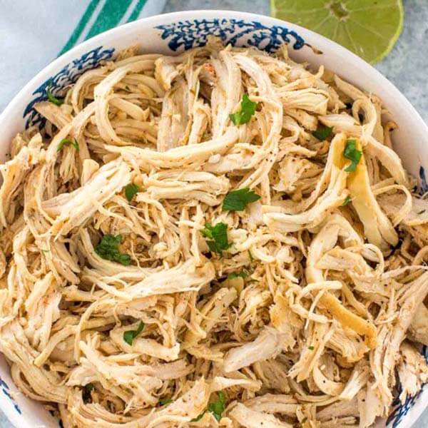 Shredded Chicken in a white bowl with blue pattern
