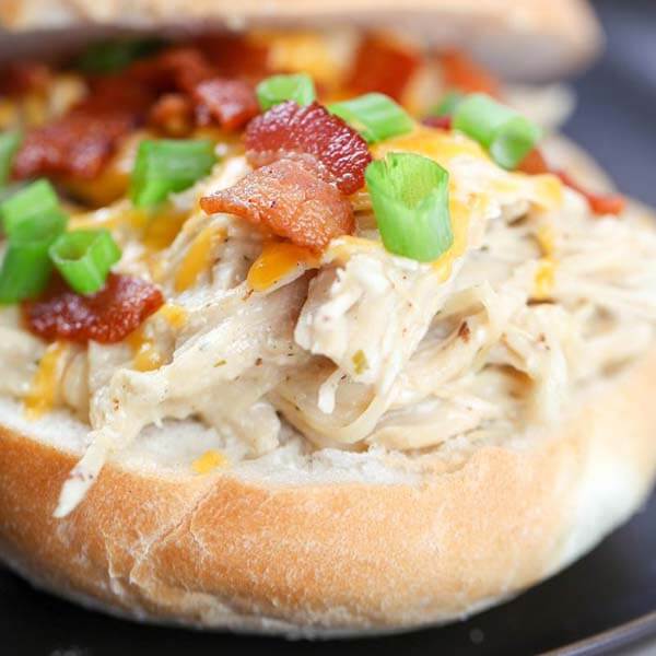 closeup of crack chicken on the bottom half of a hamburger bun