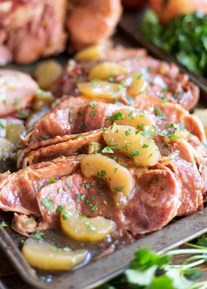 Closeup of sliced Apple Pie Ham on a baking sheet