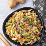 Instant Pot Egg Roll in a Bowl is a delicious low carb one pot recipe. It is a simple meat and cabbage dish with a tasty Asian flavored sauce. This pressure cooker egg roll in a bowl is also known by the name Crack Slaw. Instant Pot recipes by simplyhappyfoodie.com #instantpoteggrollinabowl #instantpotcrackslaw #crackslaw