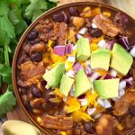 Slow Cooker Beefy Bacon Chili is a very hearty, meaty chili with a little kick of spice, and a lot of flavor! My taste testers all agreed that this is one of their favorite chili recipes! A perfect crock pot chili recipe! simplyhappyfoodie.com #slowcookerchili #crockpotchili #bestslowcookerchili