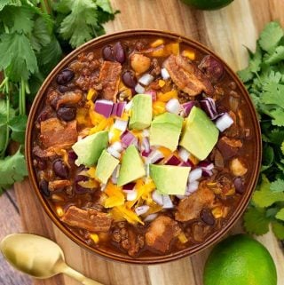 Slow Cooker Beefy Bacon Chili is a very hearty, meaty chili with a little kick of spice, and a lot of flavor! My taste testers all agreed that this is one of their favorite chili recipes! A perfect crock pot chili recipe! simplyhappyfoodie.com #slowcookerchili #crockpotchili #bestslowcookerchili