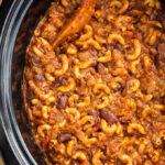 Slow Cooker Chili Mac in a black crock