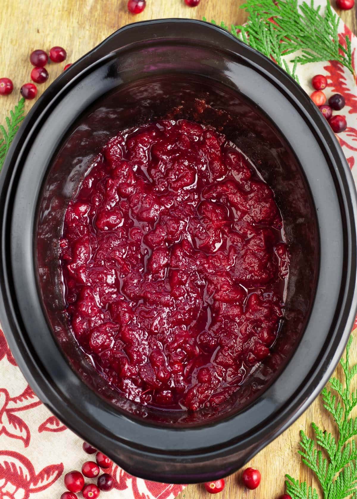 Slow Cooker Cranberry Sauce in a black crock