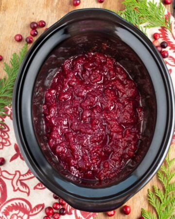 Slow Cooker Cranberry Sauce in a black crock