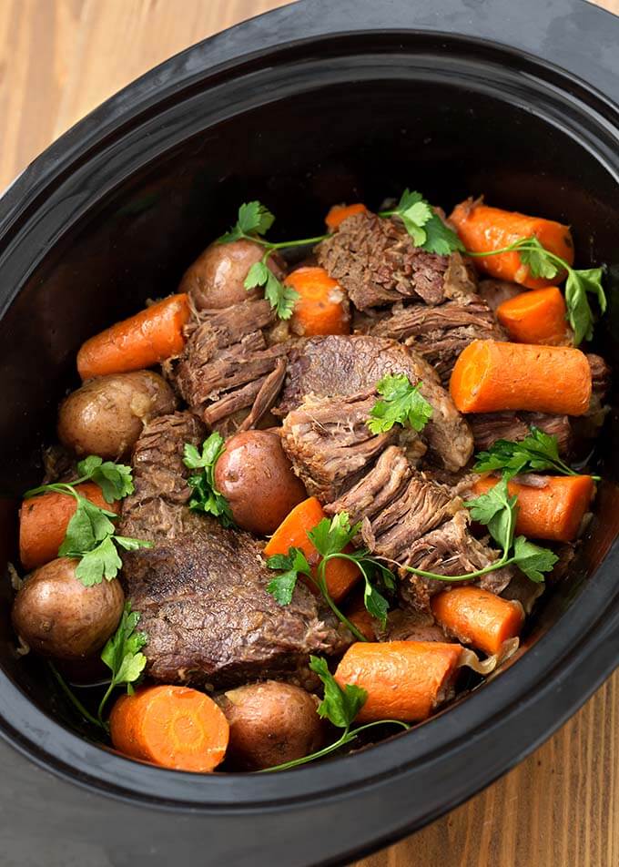 Top view of Pot Roast with vegetables in a slow cooker