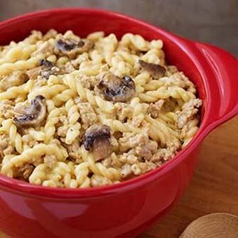 Cheeseburger Pasta in a round red baking dish