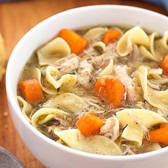 Instant Pot Mini Game Hen Noodle Soup in a white bowl