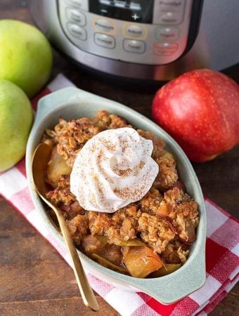 Apple Crisp in small baking dish in front of pressure cooker