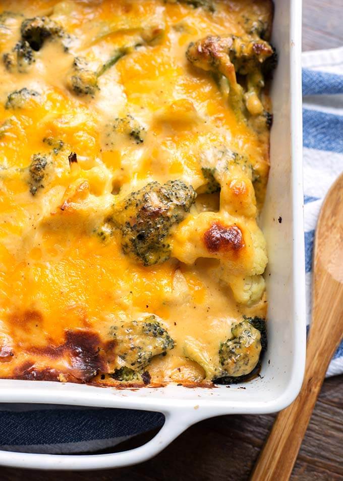 Closeup of Broccoli Cauliflower Cheese Bake in white baking dish