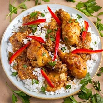 instant pot chicken adobo filipino over rice on a gray plate