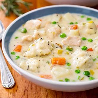 instant pot chicken and dumplings in a white bowl