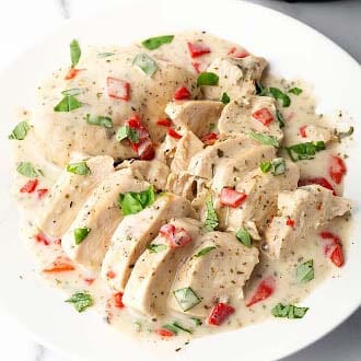 instant pot creamy italian chicken breasts on white plate