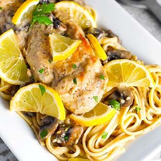 instant pot creamy lemon chicken linguine on a rectangular serving platter