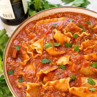 lasagna soup in a white bowl with brown rim