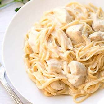 fettuccine alfredo on a white plate