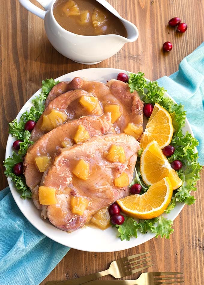 ham pineapple glaze with vegetables on white plate