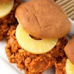 Hawaiian BBQ Sloppy Joes with slice of pineapple on a hamburger bun