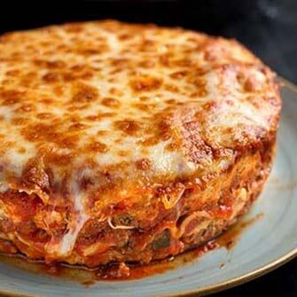 round lasagna on a white plate