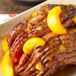 Peach Glazed Ham on white serving platter