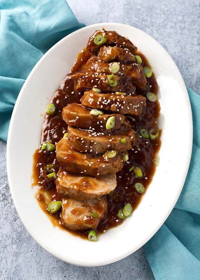 Sliced Teriyaki Pork Tenderloin on white serving platter