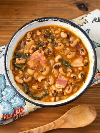 Black eyed peas in a white bowl with a black rim