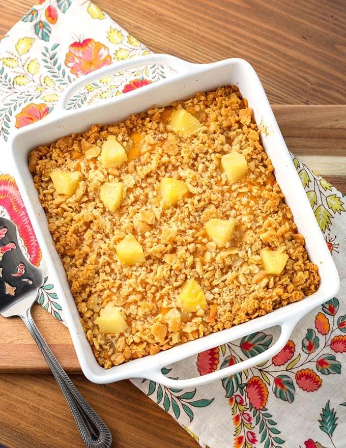 Pineapple Casserole in square white baking dish