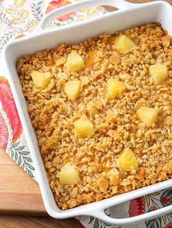 Southern Pineapple Casserole in a white square baking dish