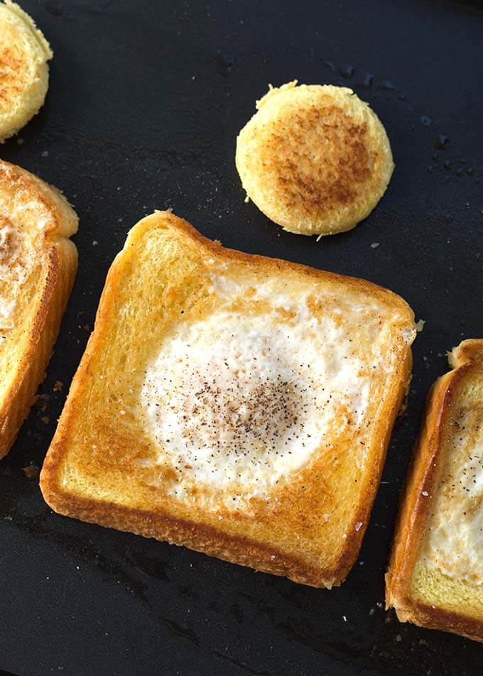 Closeup of cooked Egg in a Hole on griddle