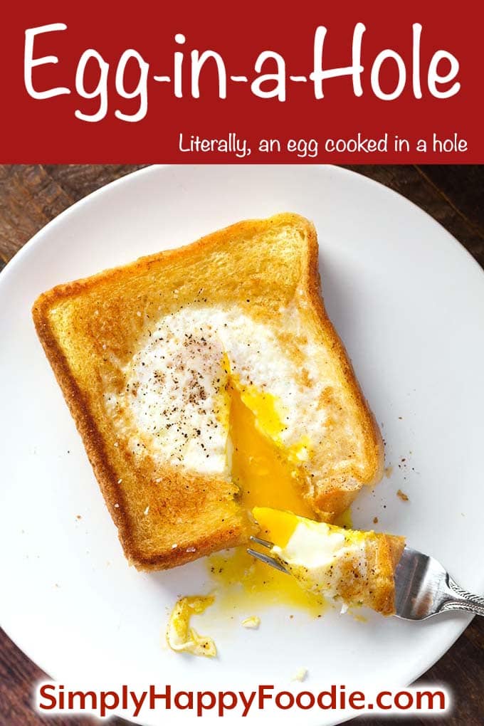 Egg in a Hole on a white plate with the title and Simply Happy Foodie's logo