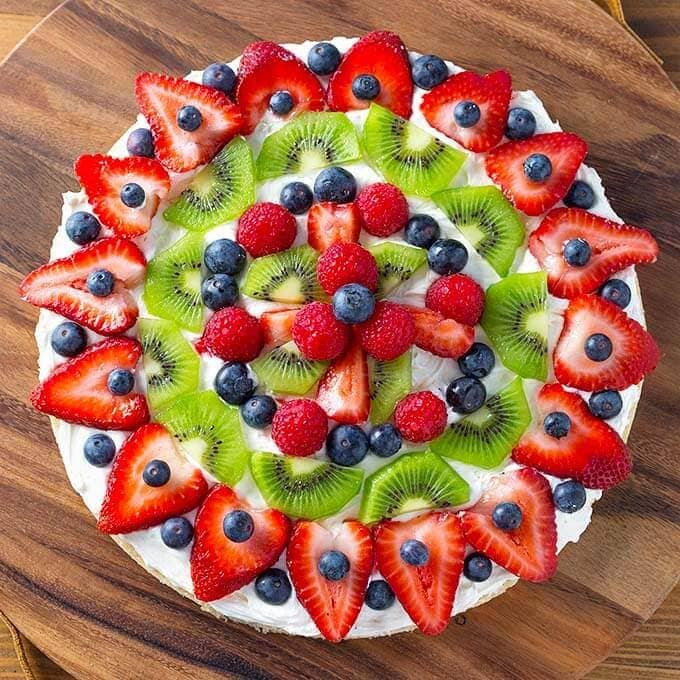 Whole Fresh Fruit Pizza on a wooden board