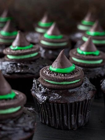 Halloween Witch Hat Cupcakes on dark wood board