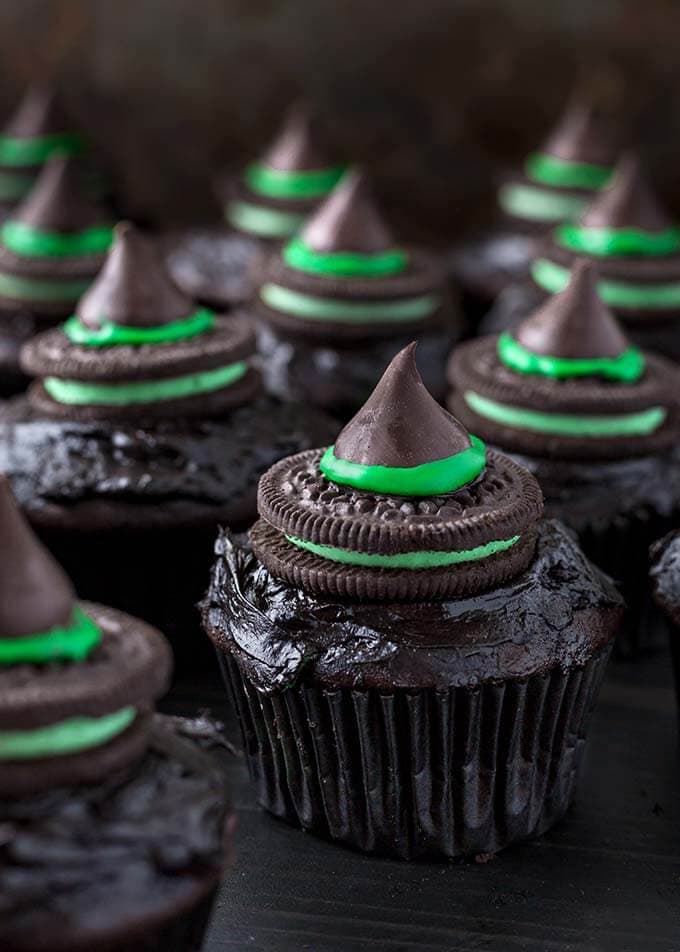 Halloween Witch Hat Cupcakes on dark wood board