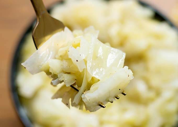 Close up of forkful of Buttered Cabbage