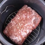 Frozen Ground Beef on trivet in a pressure cooker