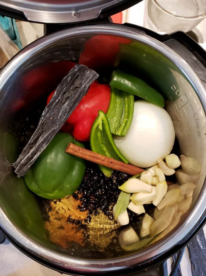 pot of beans and vegetables ready to cook in pressure cooker