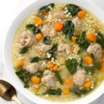 Instant Pot Italian Wedding Soup in white bowl next to two spoons