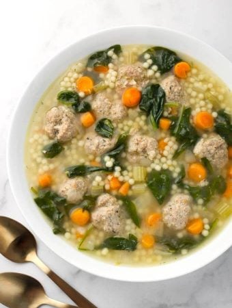 Instant Pot Italian Wedding Soup in white bowl next to two spoons