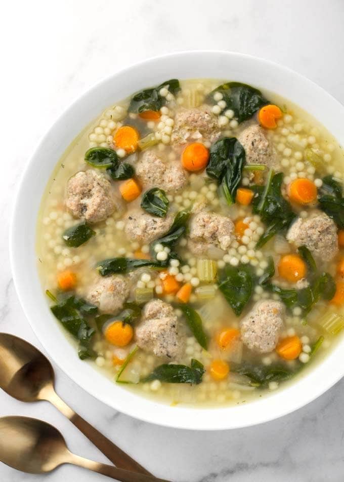 Instant Pot Italian Wedding Soup in white bowl next to two spoons