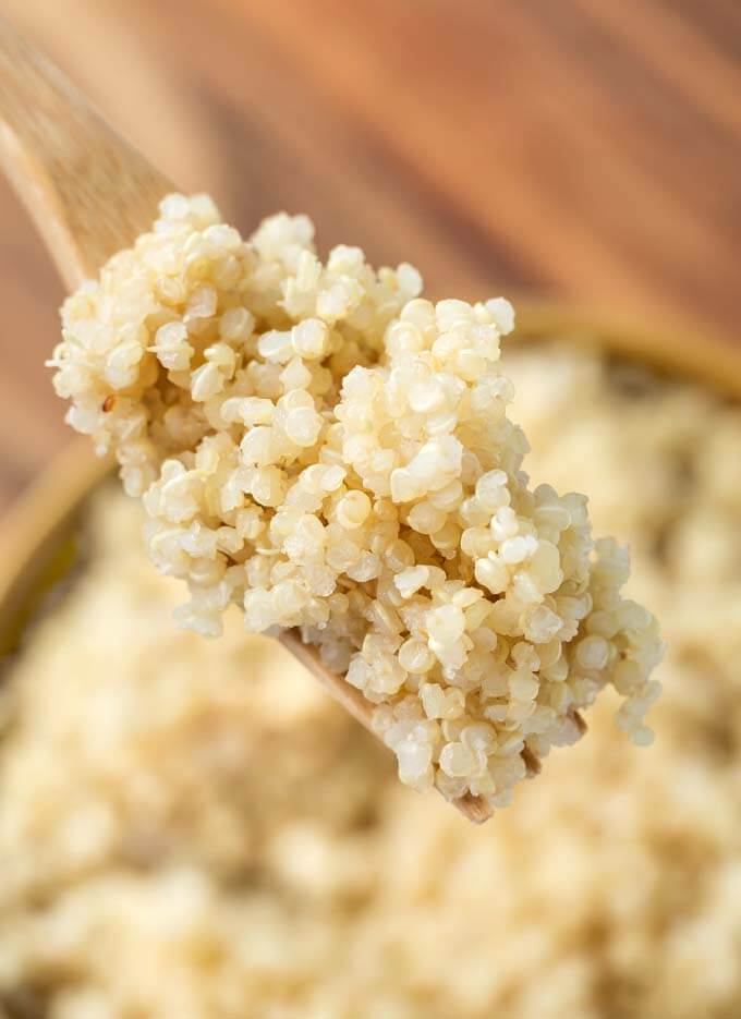 Close up of wooden fork with Quinoa