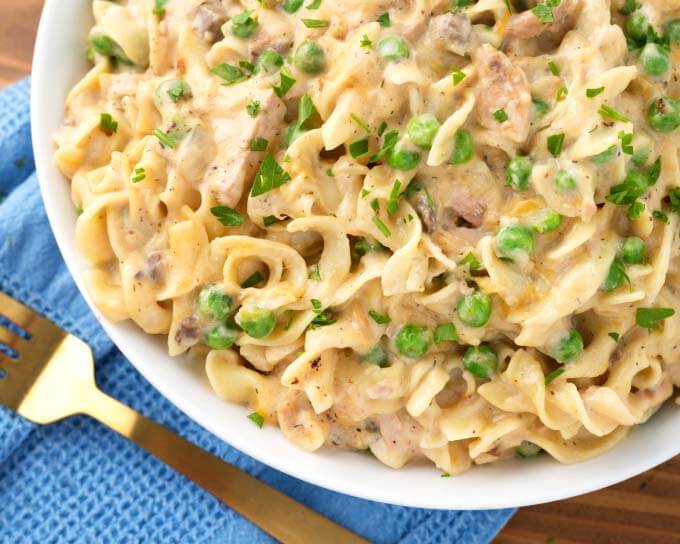 Tuna Casserole on white plate next to gold fork