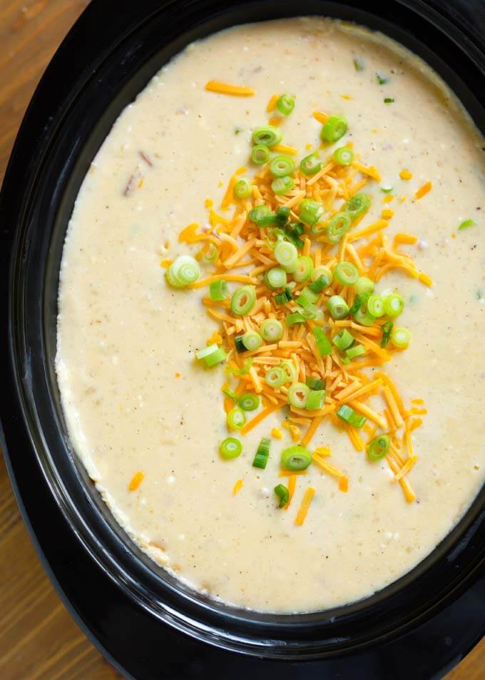 Loaded Potato Soup in a black slow cooker