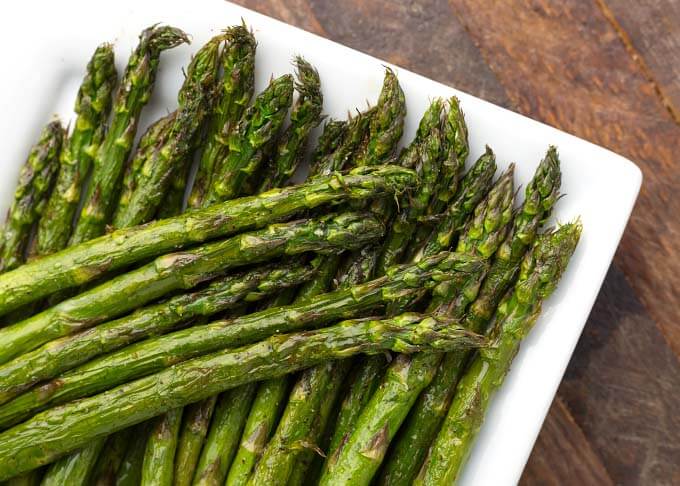 Close up of Air Fryer Asparagus on white dish