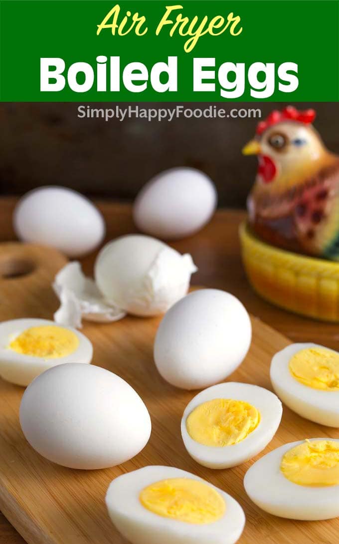 Air Fryer Boiled Eggs on wooden board with title and Simply Happy Foodie.com logo