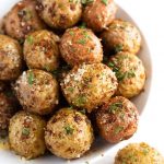 Air Fryer Garlic Parmesan Potatoes in a white bowl