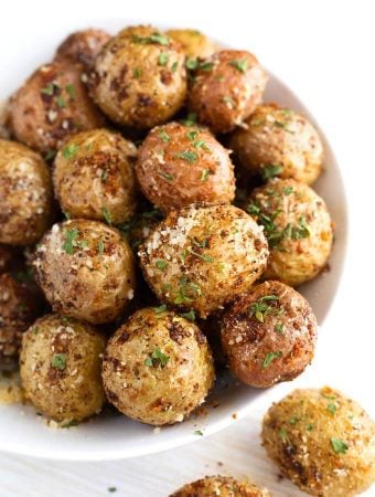 Air Fryer Garlic Parmesan Potatoes in a white bowl