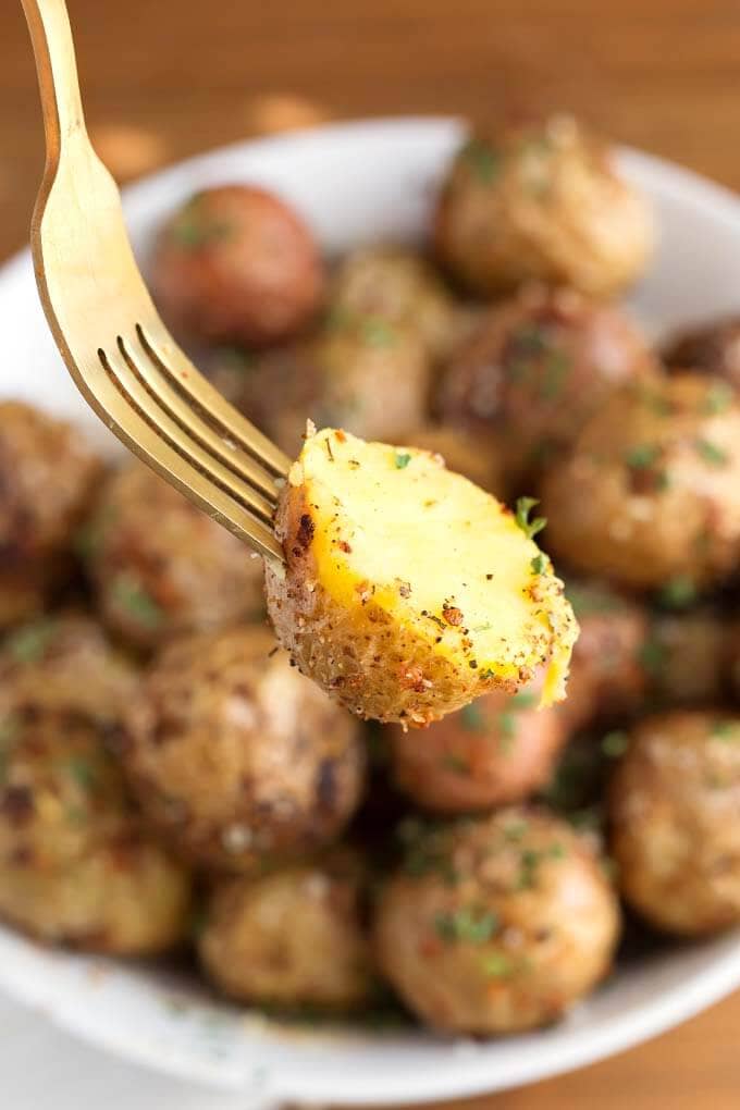 Close up of fork holding Air Fryer Garlic Parmesan Potatoe