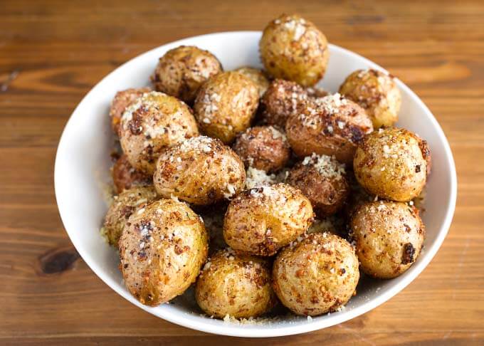 Several Air Fryer Garlic Parmesan Potatoes in a white bowl